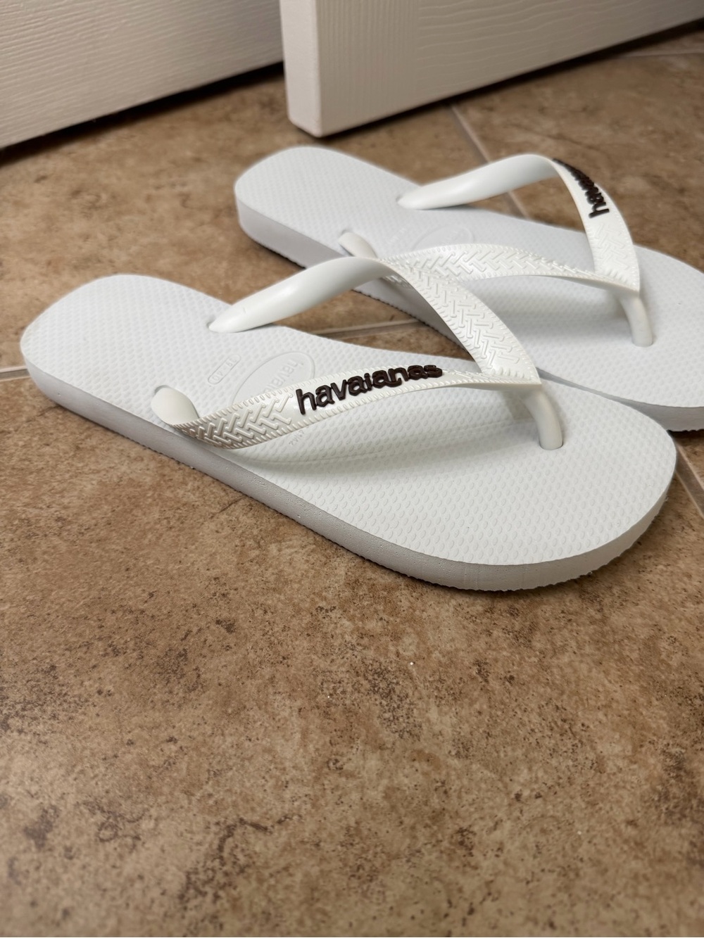 Havaianas White Flip Flop Sandals with Brown Logo